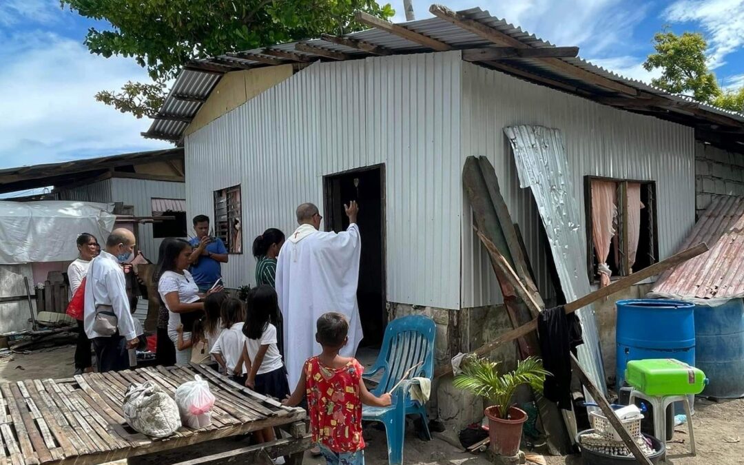 Together in celebration: Blessing the new homes of typhoon survivors in Gilutongan Island, in the Philippines